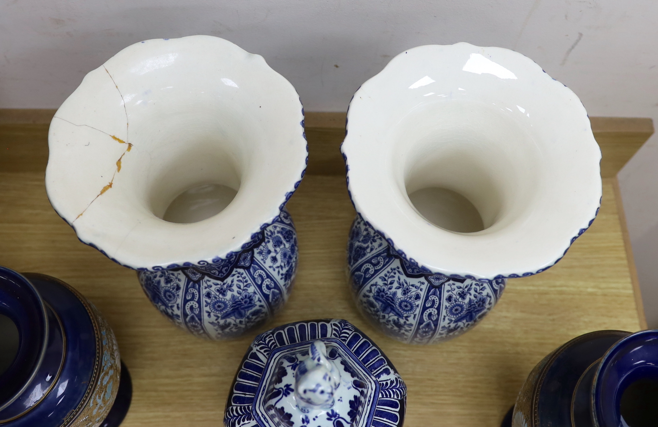 Seven ceramic pieces including a pair of Royal Doulton vases, Coalport dish and Delft jar and cover, 34cm high